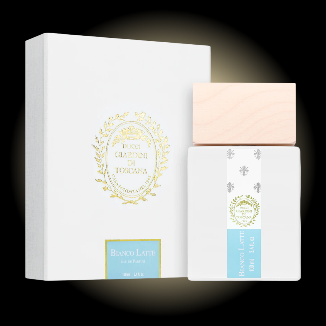 Frasco de perfume Bianco Latte de Giardini Di Toscana 100ml, botella de cristal cilíndrica con etiqueta blanca minimalista y tapón de madera clara. Fragancia de nicho original disponible en Costa Rica en formato completo y decants.
