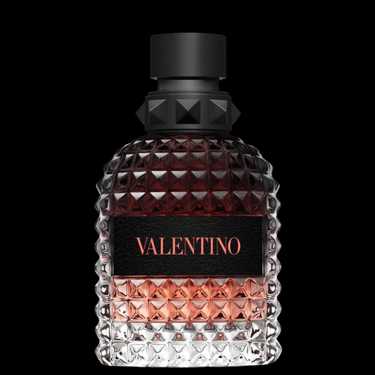 Imagen del perfume Valentino Born In Roma Uomo Coral Fantasy 100 ml para hombre, frasco naranja coral con detalles negros, fragancia frutal y amaderada con manzana roja y tabaco, disponible en Costa Rica.