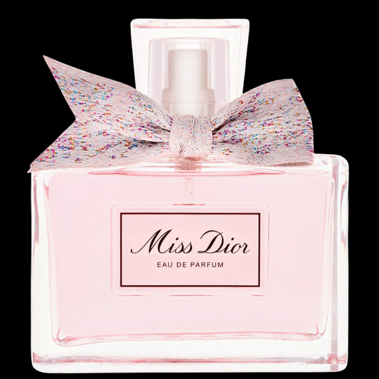 Imagen del perfume Miss Dior Eau de Parfum 100 ml para mujer, frasco elegante con lazo plateado y líquido rosado, fragancia floral romántica de Dior disponible en Costa Rica en decants y botella original.